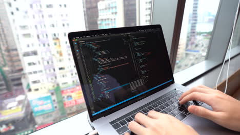 Person coding, programming on Visual Studio Code