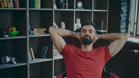 successful businessman relaxing in cozy office. portrait of young entrepreneur