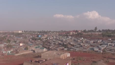 Aerial-view-of-urban-settlement-with-highway-in-the-background