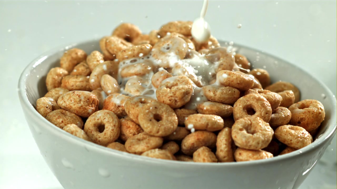 Slow Motion Milk Pouring into a Bowl of Cereal