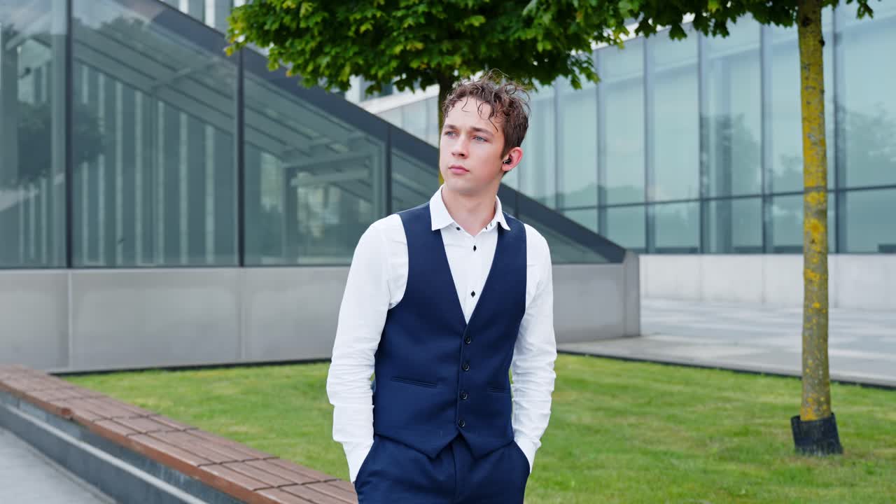 Handsome Young Businessman Walking In The City Outdoors - Medium Shot