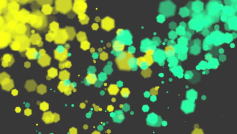 Motion-yellow-and-green-glitters-with-hexagons-bokeh-on-black-background