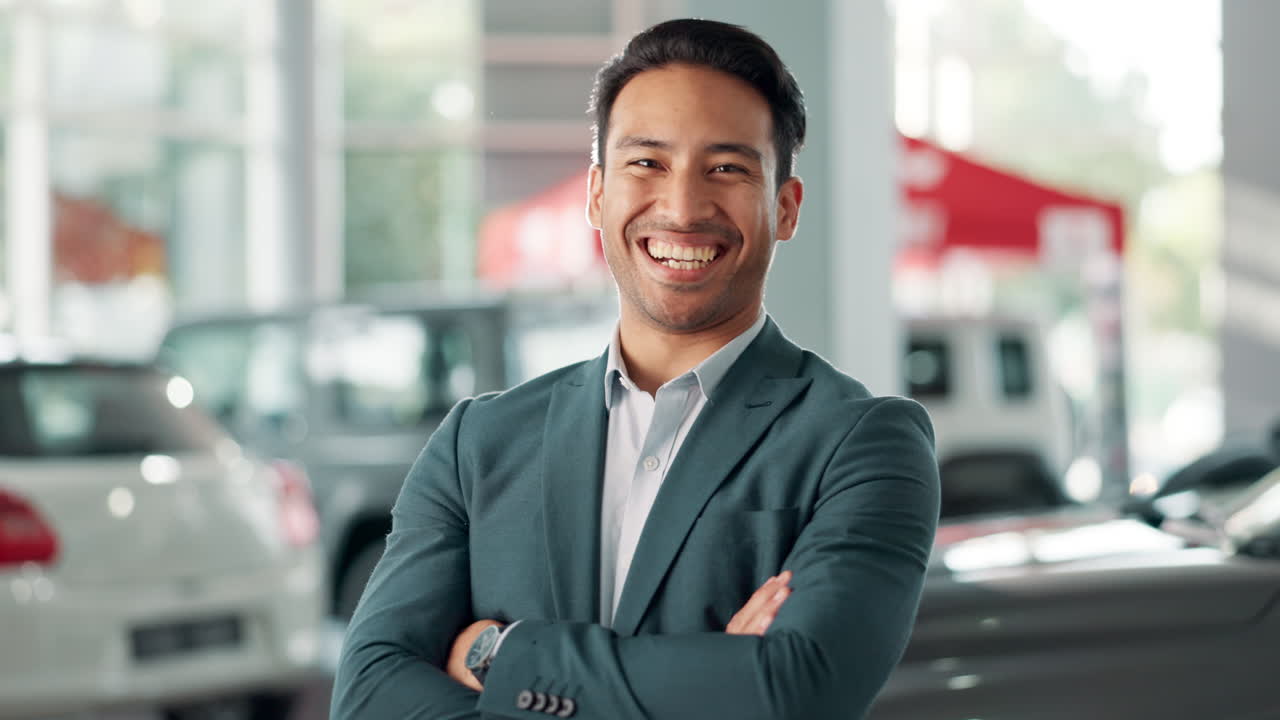 Smiling businessman in a car dealership