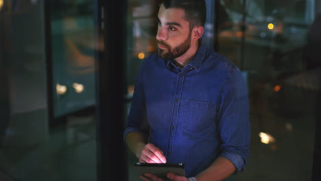 two businesspeople working together on a digital