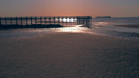 fast pan back of drone over a beach