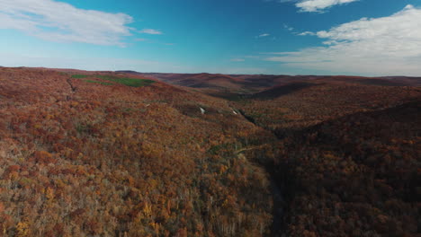 panoramic view over the colorful autumn forests of arkansas, usa - drone shot