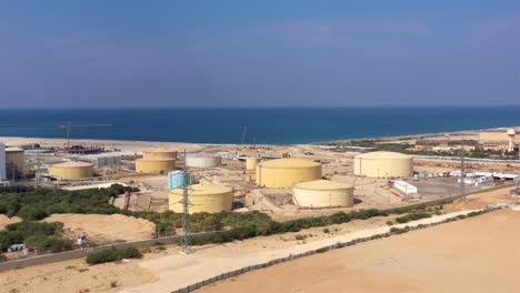 aerial footage over fuel tanks close to power plant