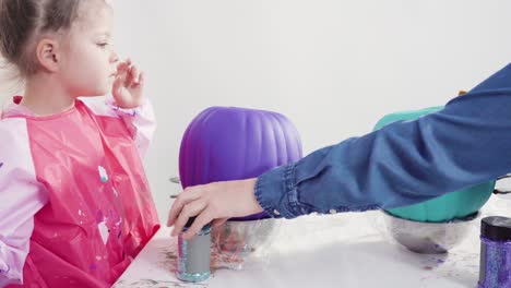 decorating art pumpkins in mermaid theme for halloween