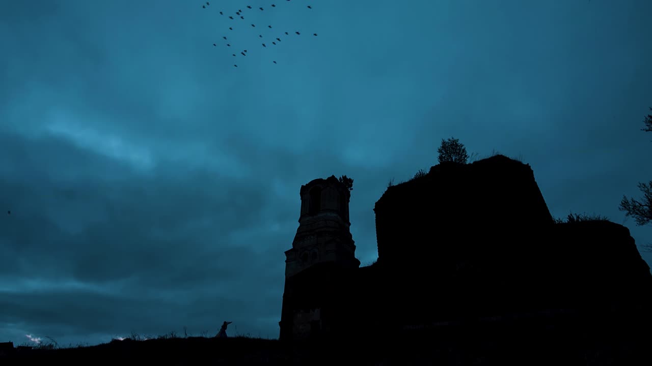 Silhouette of a Ruined Church at Dusk