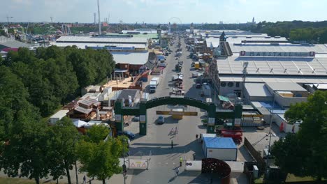 welcome majestic aerial top view flight october festival entrance empty theresienwiese, sunny day shortly before opening