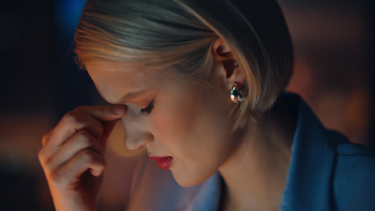 Night manager feeling eyestrain tired overload massaging neck workplace portrait