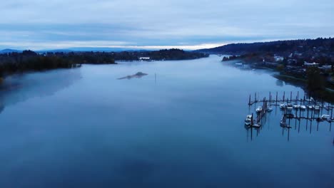 aerial drone moving forward above willamette river at dusk, portland oregon