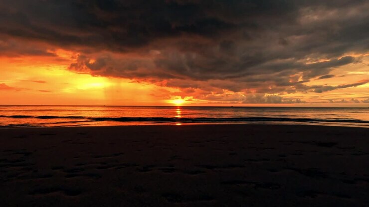 Hyperlapse of dramatic tropical summer sunset over the sea with an expansive view of the horizon seen in Sugar Beach in Sipalay, Negros Occidental, Philippines