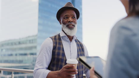 Black-man,-woman-and-tablet-in-city-for-planning