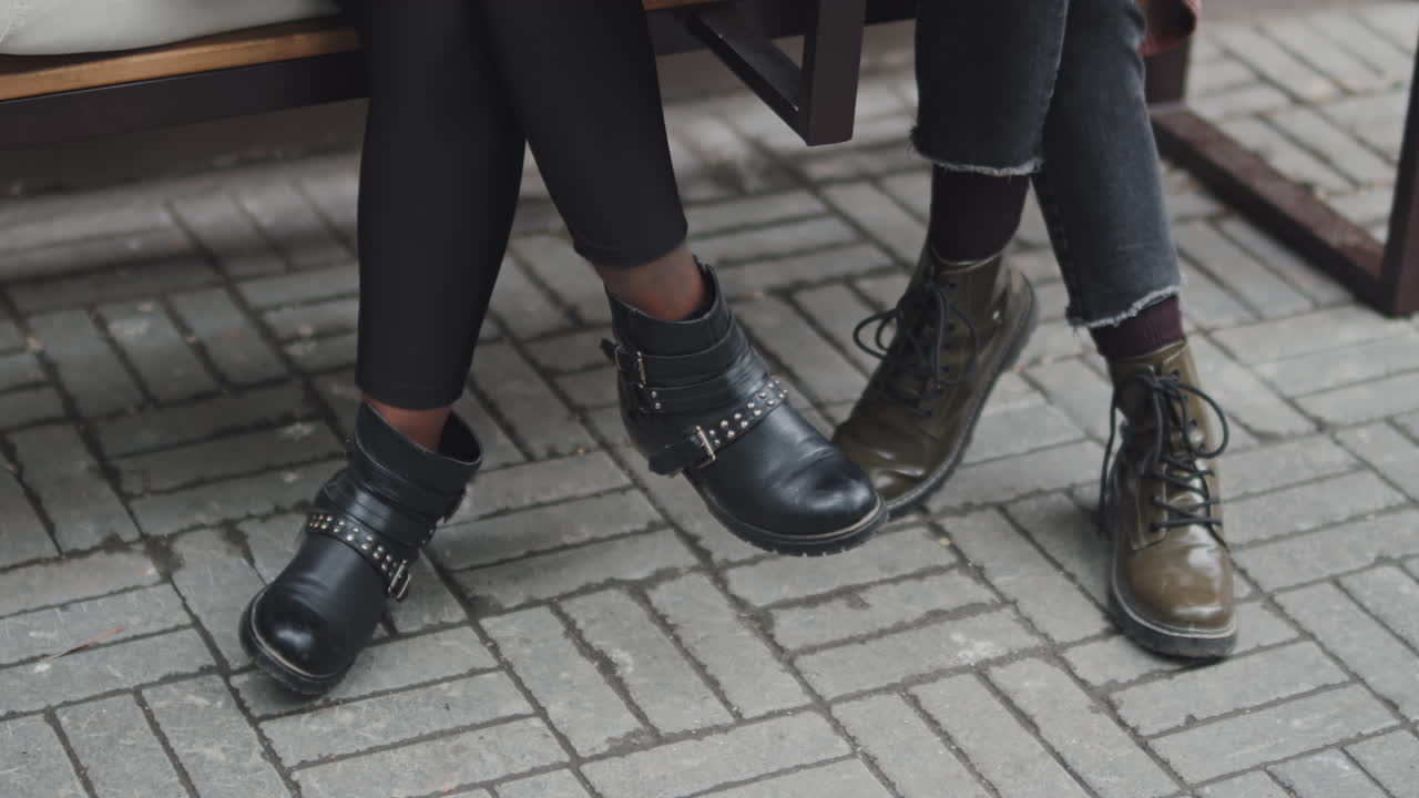 Legs of Women Sitting on Bench