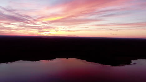 aerial over beautiful lake at sunset