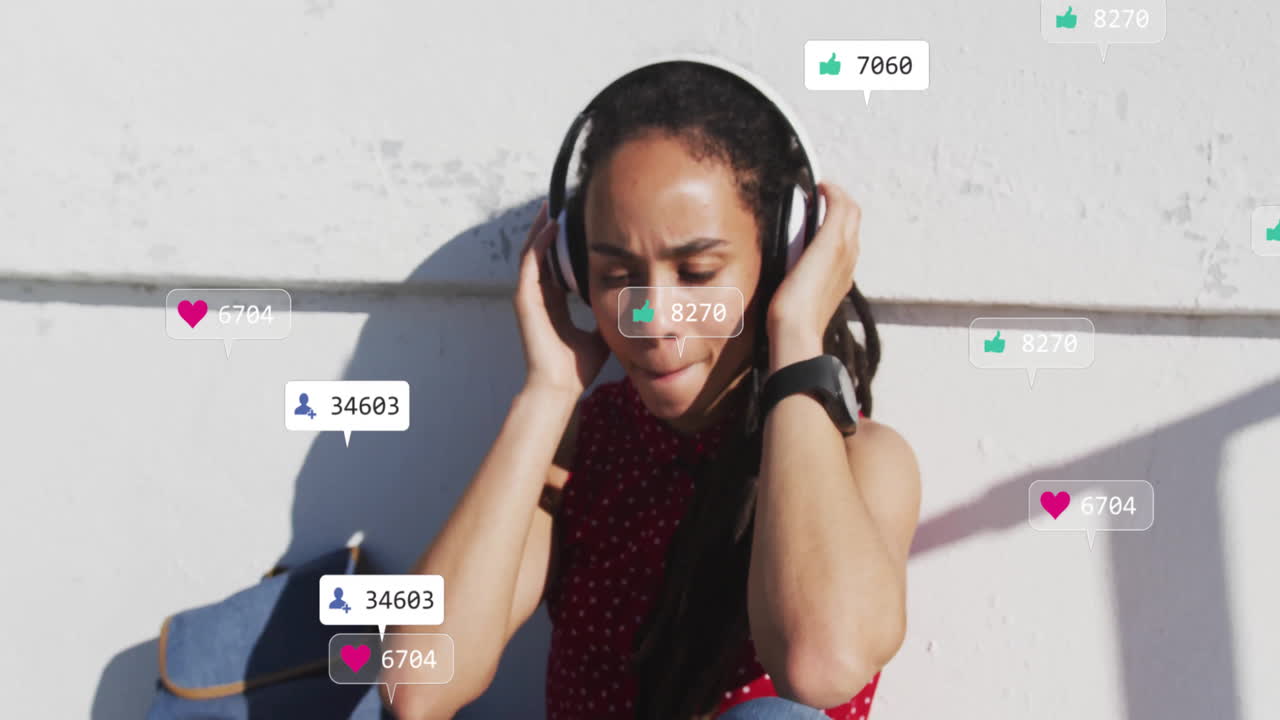 Listening to music, young woman with social media notifications floating around