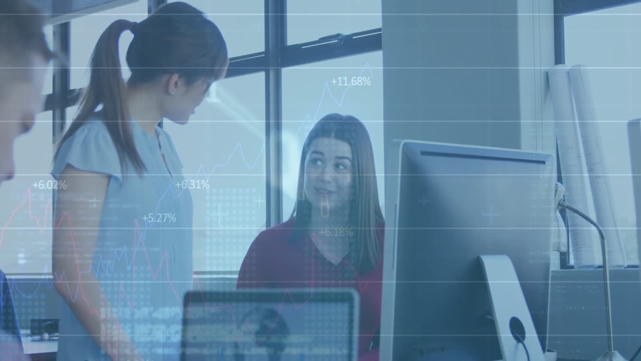 Asian engineer walking to peer and pointing at data chart with code overlays for tech discussion