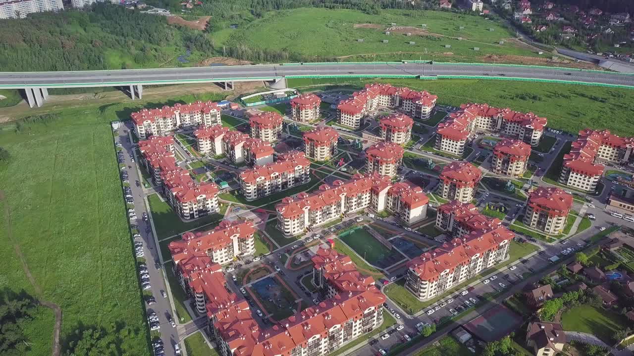 Aerial View of Residential Complex with Highway
