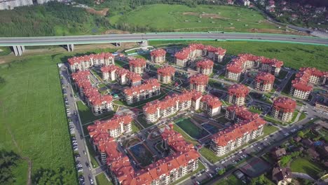 aerial view of residential complex with highway