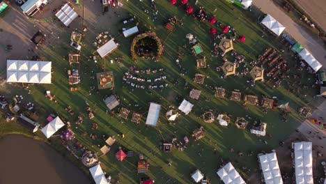 a dynamic top down descending aerial footage towards the feria masticar food festival in buenos aires city from a high altitude