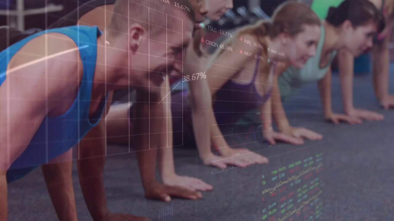 Instructor cueing six fitness participants performing in-sync push-ups on mats for strength gain