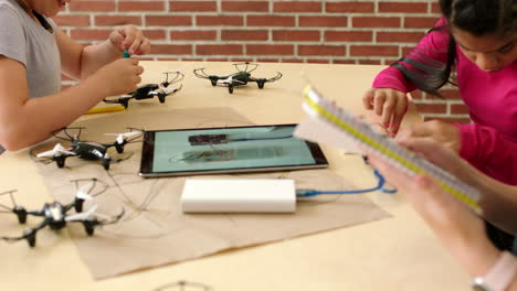 girls learning about robotics and drones