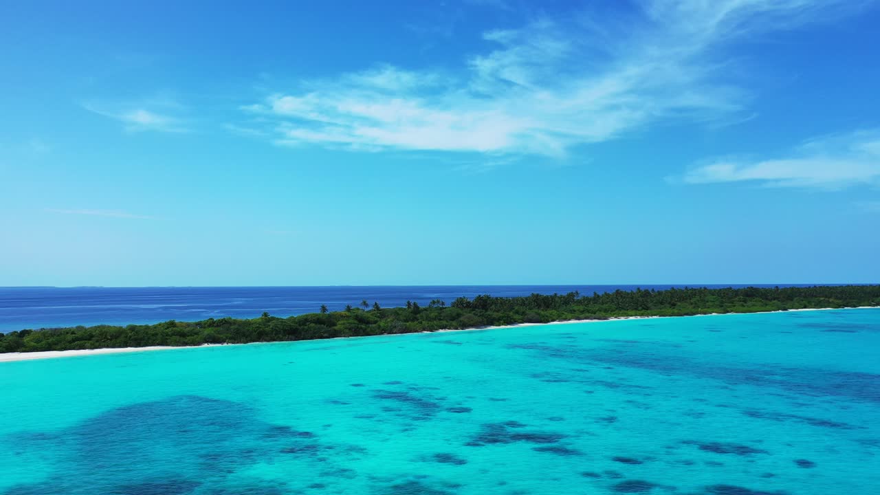 Paradise tropical island with lush vegetation and long white beach between calm turquoise lagoon and deep blue ocean under bright sky of Barbados