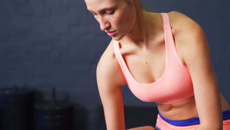 Woman-exercising-with-dumbbell