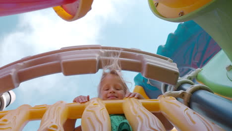 low angle view of smiling girl at playground