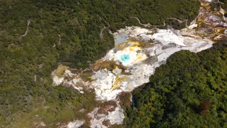 Steaming-Geothermal-Area-At-Orakei-Korako-Thermal-Park,-The-Hidden-Valley,-North-Island,-New-Zealand---aerial-drone-shot