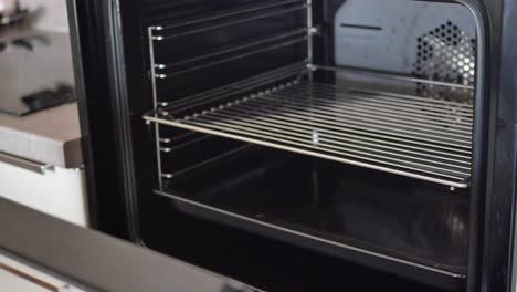 Open-electric-oven-at-home,