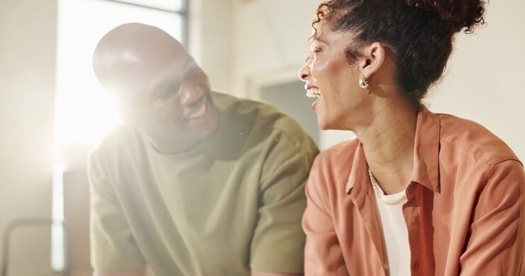 Happy Couple Laughing Together in a Bright Modern Home
