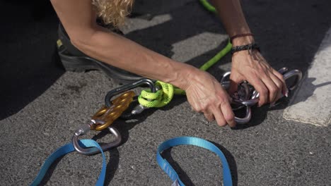 firefighter attaching carabiner to rope in training exercise