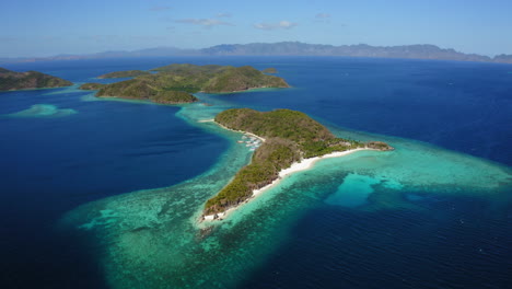 Aerial-view-of-Malcapuya-Beach-island-in-a-sunny-day,-Coron,-Palawan,-Philippines