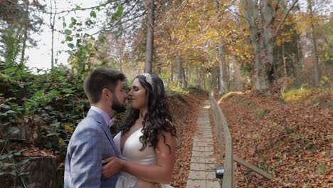 groom with bride near mountain hills in the forest. couple. making a kiss