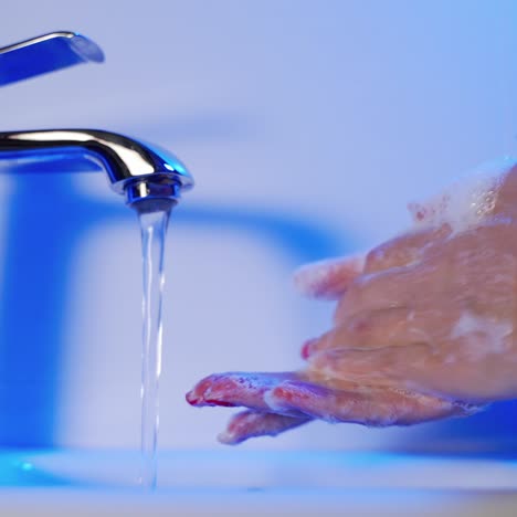 woman washing hands in the washroom. hygiene. cleaning hands.