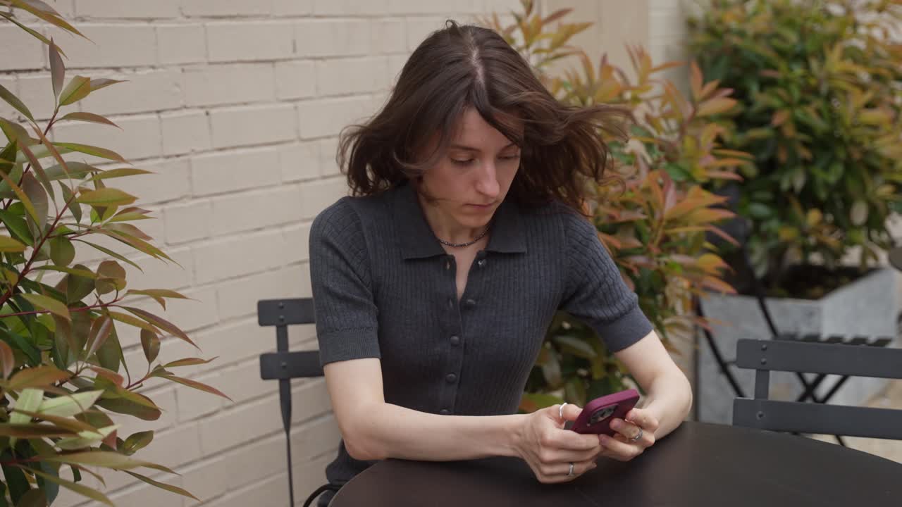 Woman using smartphone outdoors