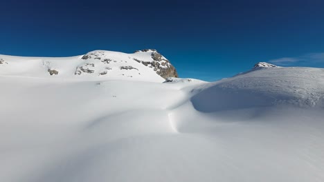 pan shot of the crans-montana ski slope, swiss alps, switzerland