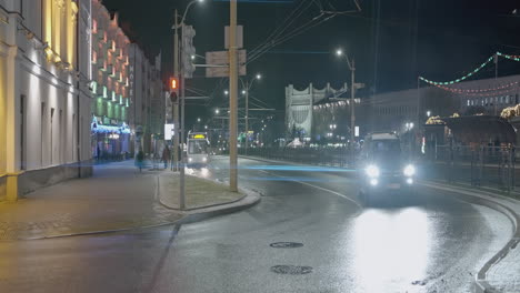 night city street scene with traffic and pedestrians