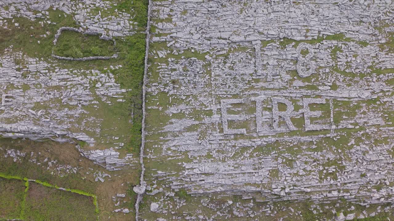 Aerial shot of the iconic 'EIRE 48' sign made of rocks in the Burren, Ireland