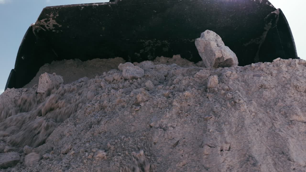 Heavy Excavator Digging Rocks and Gravel at Mining Site