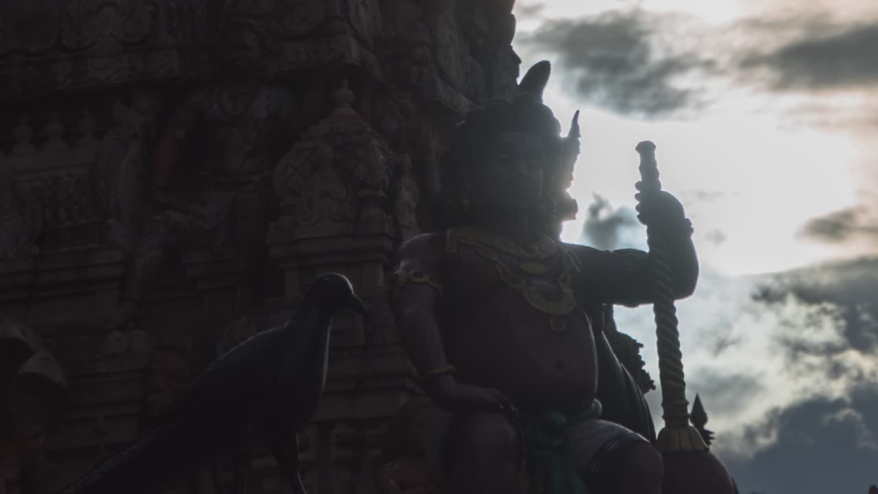 Silhouette of a Temple Carving at Sunrise/Sunset