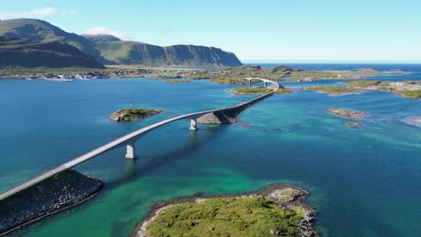 lofoten islands bridge and scenic route across turquoise blue water in norway, scandinavia - aerial