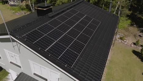 Aerial view around a house powered by solar cells, sunny, summer day in Finland