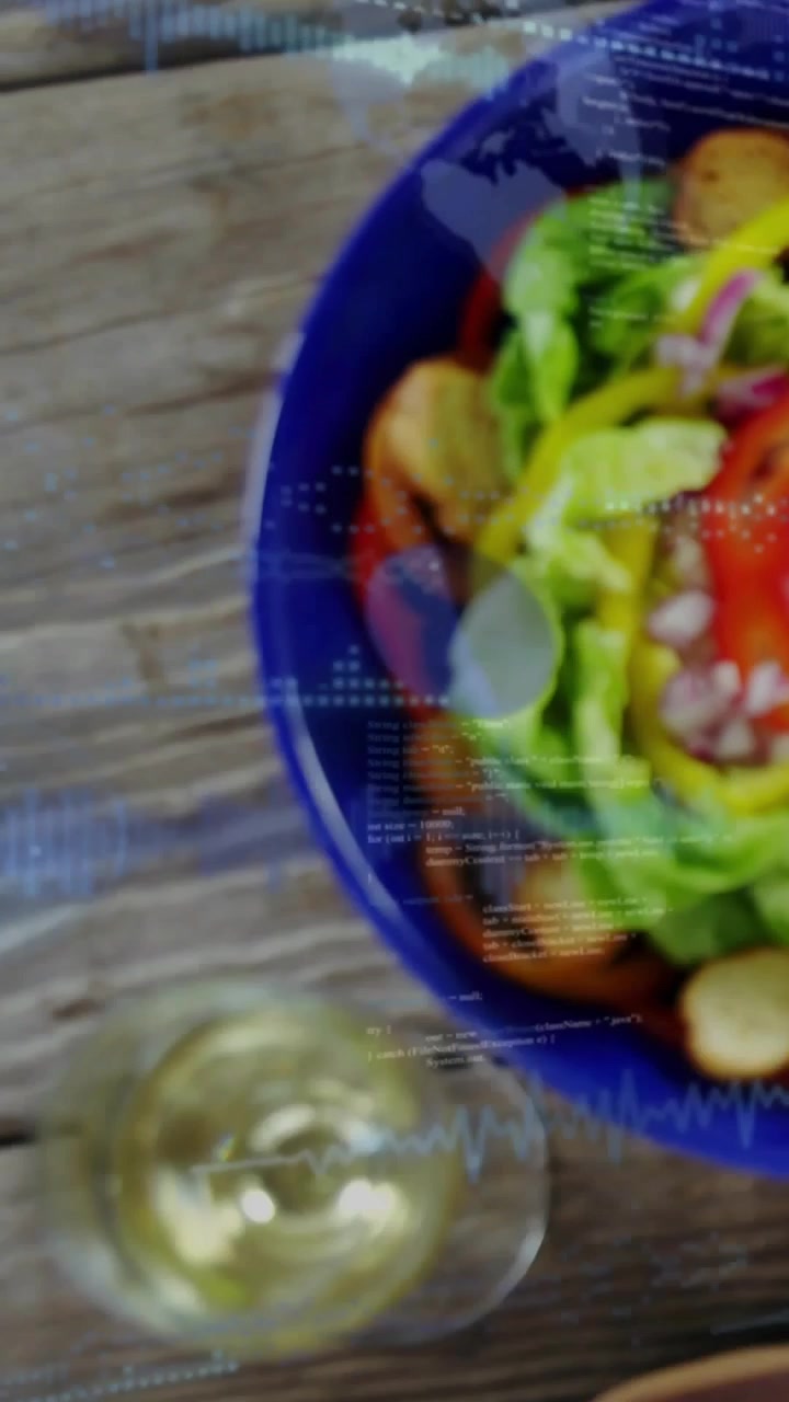 Vertical video: Camera pulling back, revealing salad bowl, blue overlay showing info for food promo