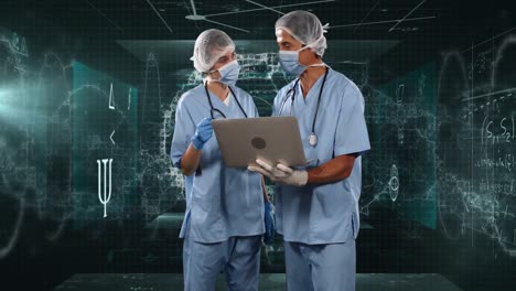 female and male surgeons using laptop against screens with medical data processing