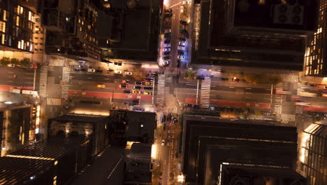 Aerial-birds-eye-overhead-top-down-view-of-traffic-in-streets-of-city.-Night-hyperlapse-of-moving-vehicles.-Manhattan,-New-York-City,-USA