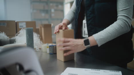 warehouse worker packaging and processing orders