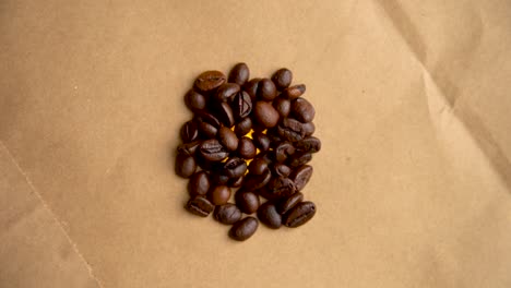 pile of coffee beans rotates in a circle filming from above